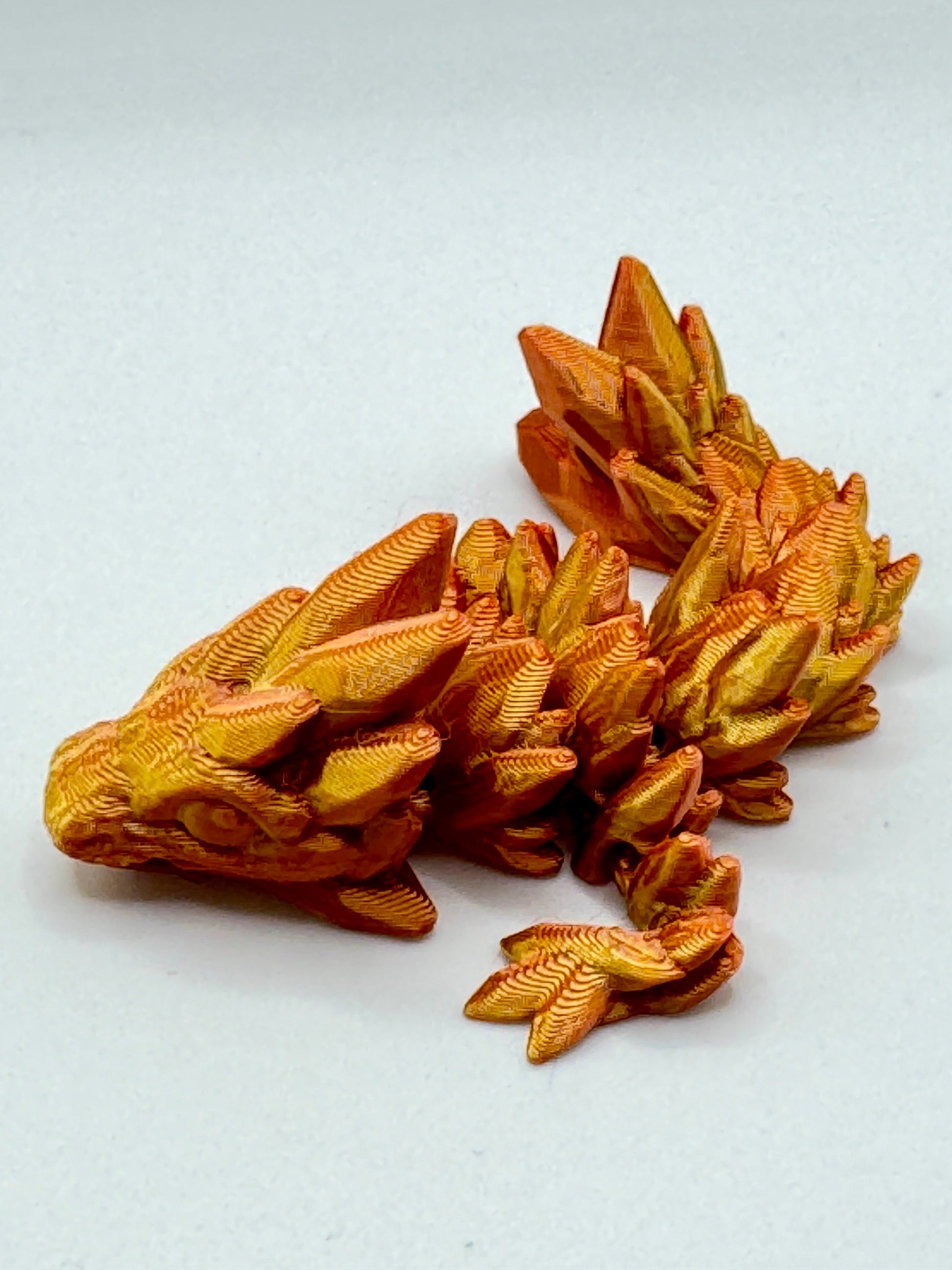 Discover Adorable Magic with our Articulated Baby Gemstone Dragon - 3D Printed in Gold with Cinderwing Design!