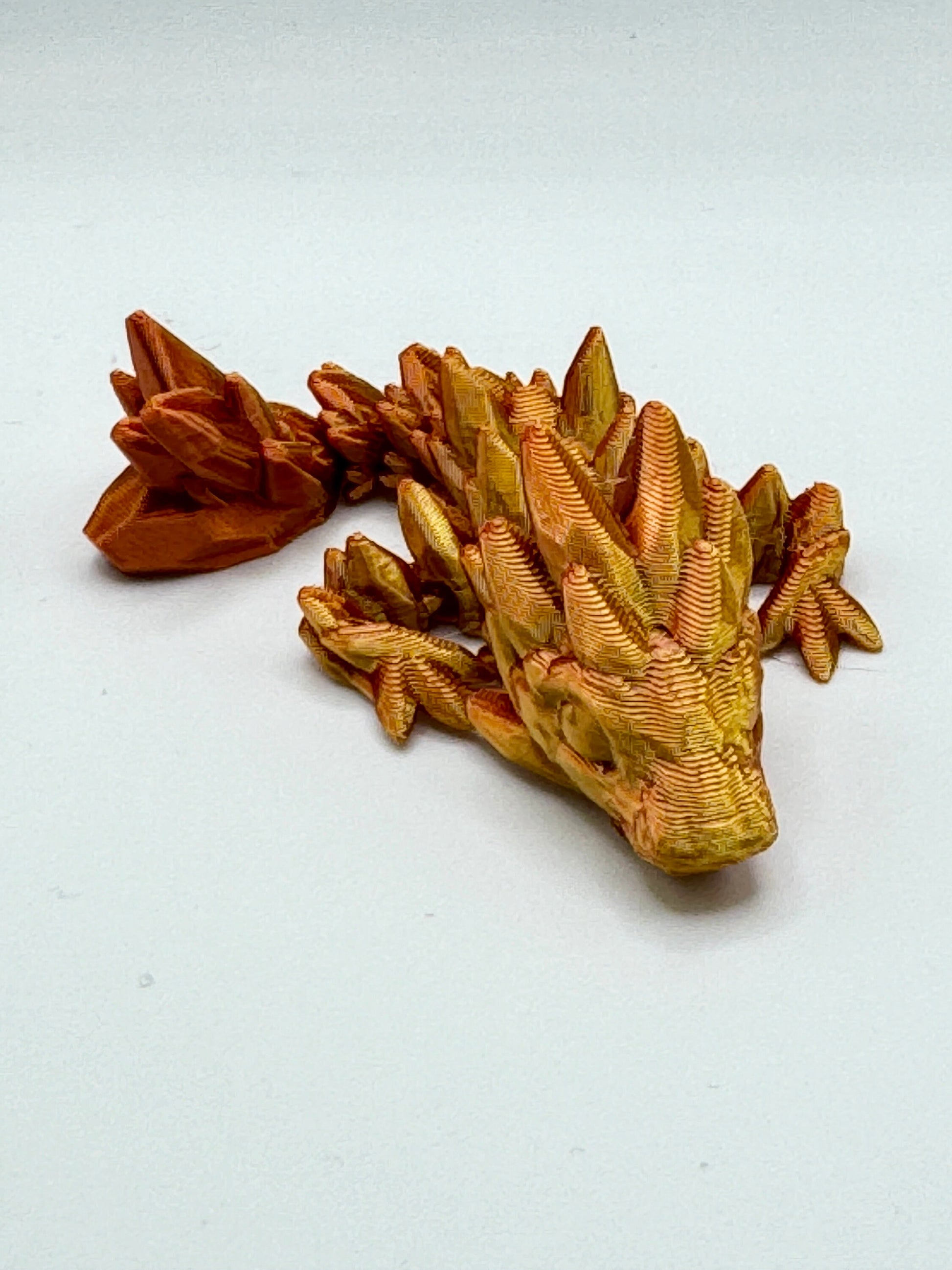 Discover Adorable Magic with our Articulated Baby Gemstone Dragon - 3D Printed in Gold with Cinderwing Design!