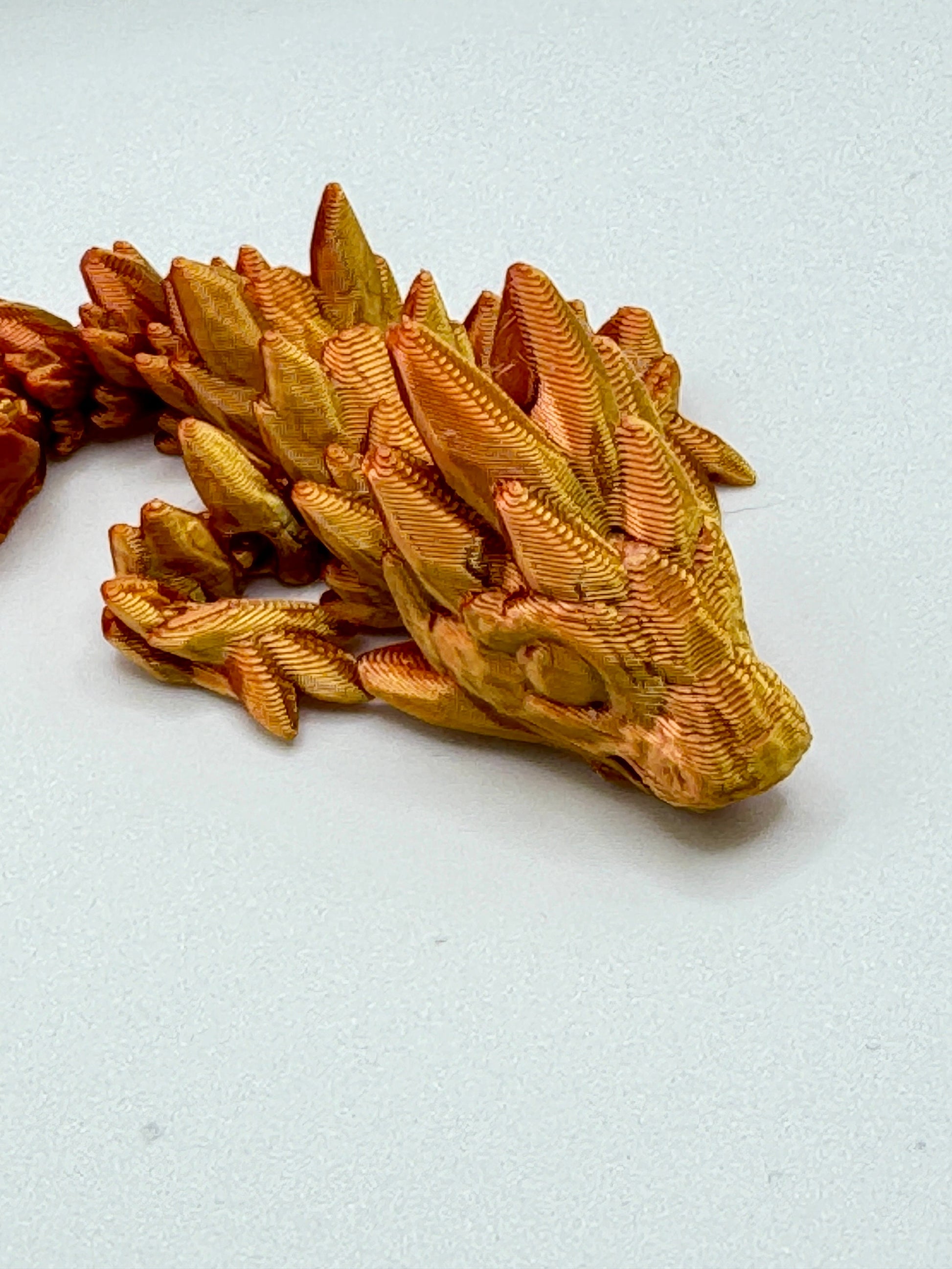 Discover Adorable Magic with our Articulated Baby Gemstone Dragon - 3D Printed in Gold with Cinderwing Design!